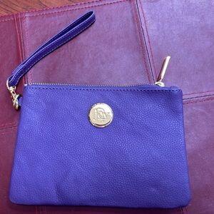 Joy Mangano Leather Royal Purple Wristlet, 8x6”. Carry strap. Gold hardware,logo